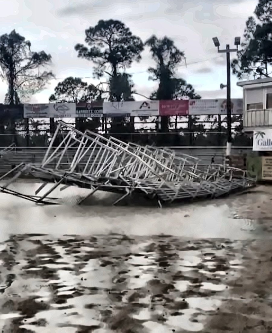 The arena's aluminum grandstand frame twisted and collapsed in the flooded arena after Hurricane Helene